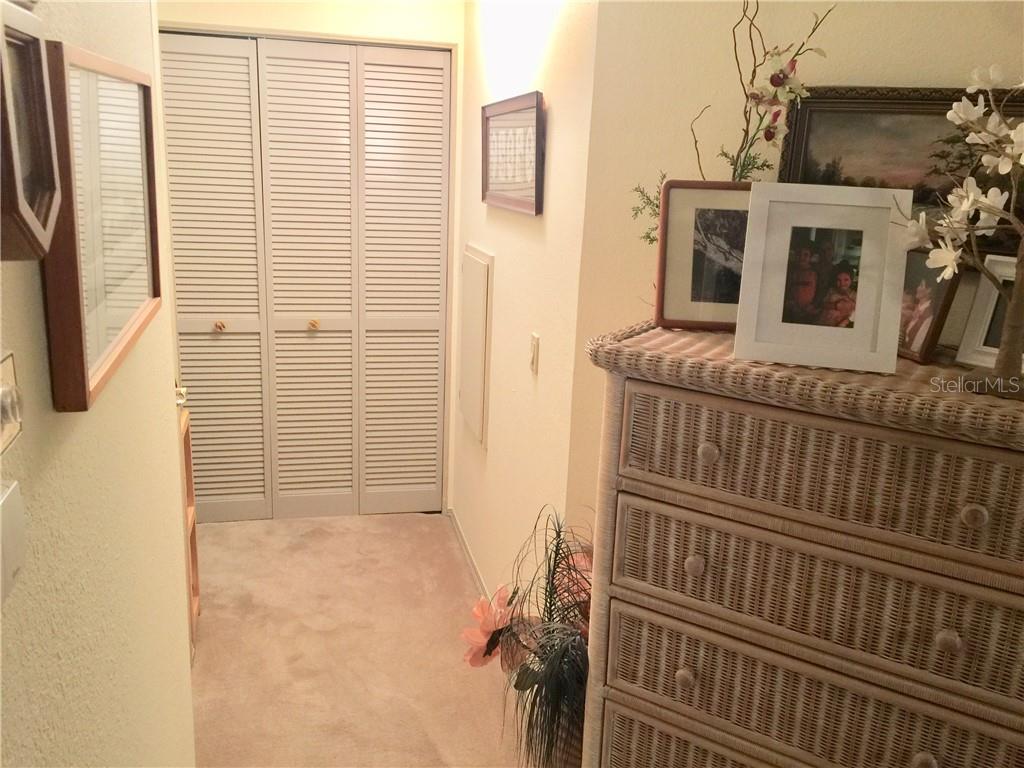 HALLWAY LEADING TO GUEST BATH AND LAUNDRY NOOK