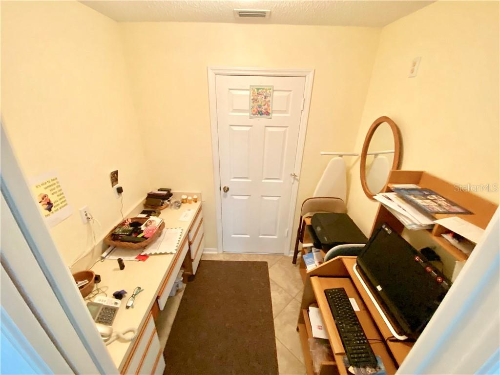 OFFICE OFF OF KITCHEN LEADS INTO GARAGE