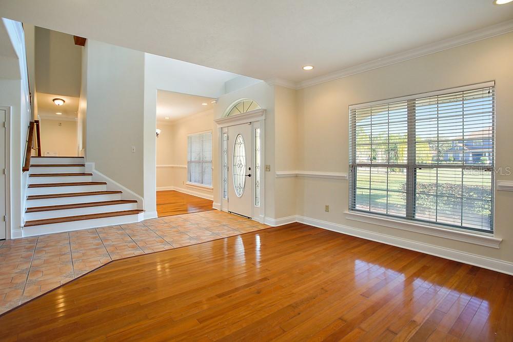 Den looking into Foyer and Dining Room.
