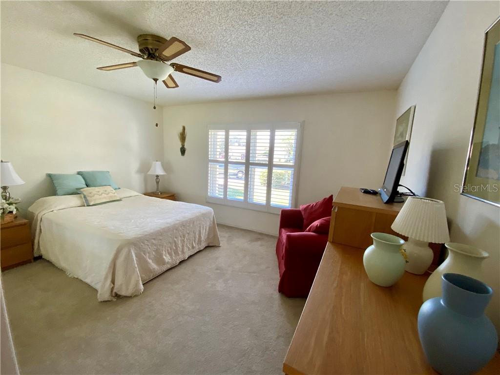 LARGE GUEST BEDROOM HAS DOUBLE DOORS AT ENTRANCE