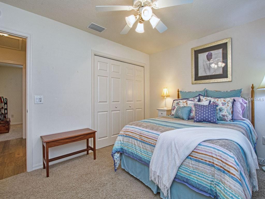 Enter the Guest Bedroom off the hallway behind the French doors