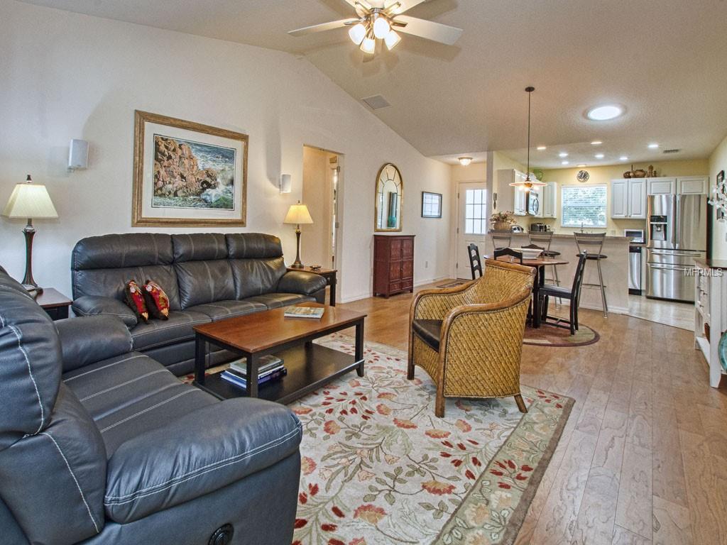 Love the openness. Note the high ceilings & Solar Tube; Guest Bedrooms to left