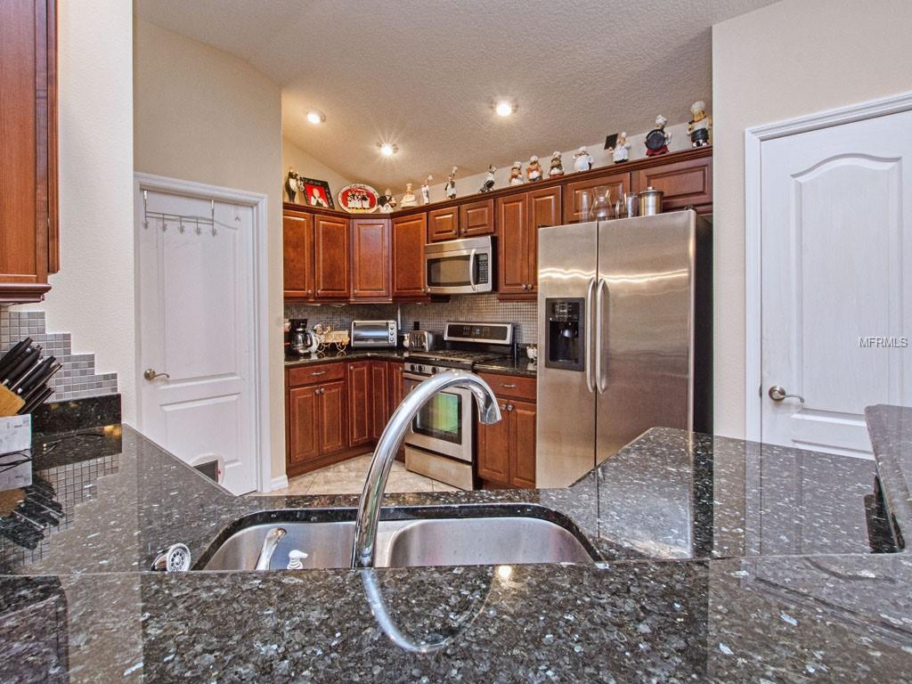 Beautiful Granite counter. Pantry to Right