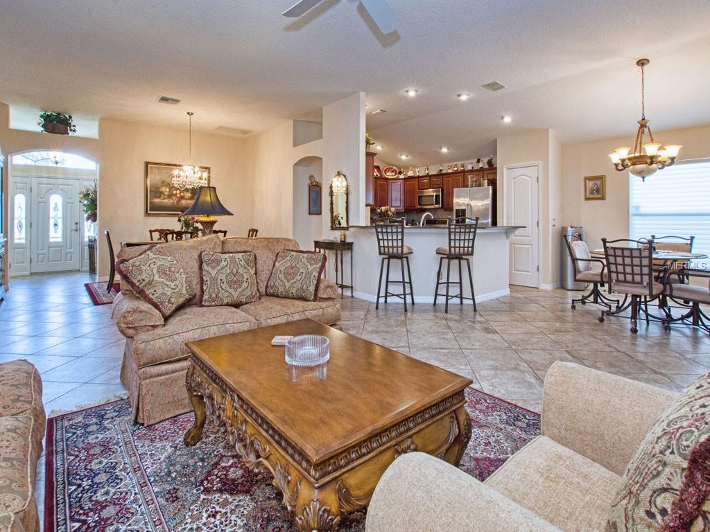 From the couch, look at the front door, kitchen and Dinette