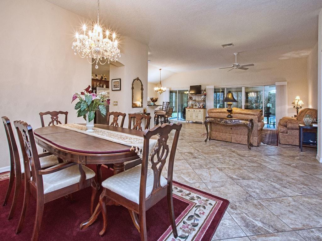 After dining, relax in the Living Room and, through sliders, in the Florida Room