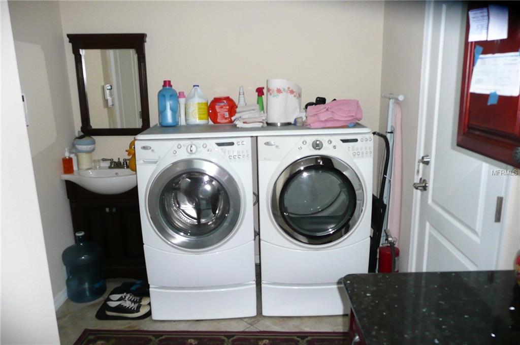 Vanity, Washer/Dryer &  Door to Garage