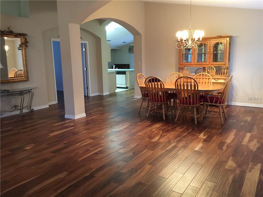 LIVING ROOM, DINING ROOM, AND HALLWAY SHOWING BEAUTIFUL ACADIA FLOORING