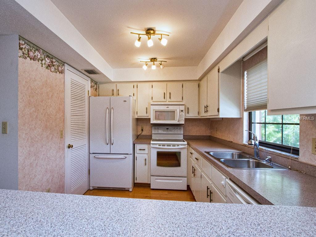 Efficient cook space with Pantry and French-Door Fridge with bottom Freezer.