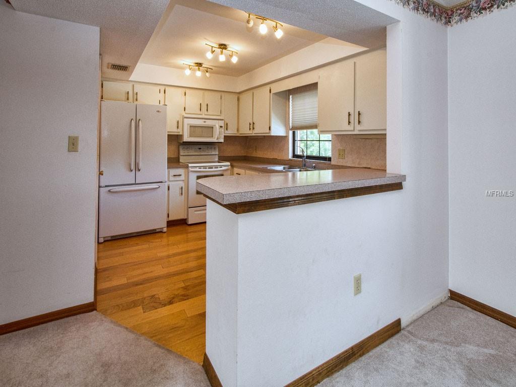 Beautiful from tray ceiling to rich wood floors.