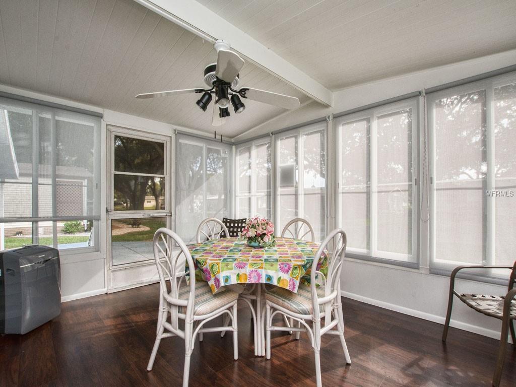 LANAI WITH CUSTOM ROLL DOWN SHADES