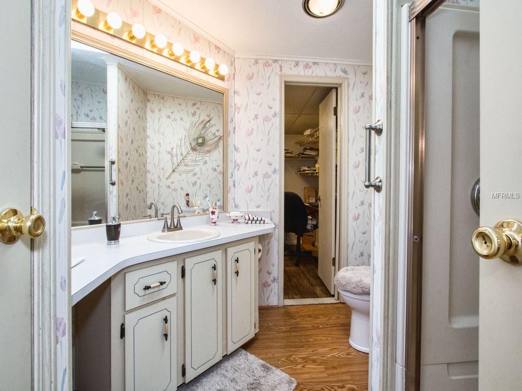 MASTER BEDROOM BATH (LAUNDRY IN BACKGROUND)