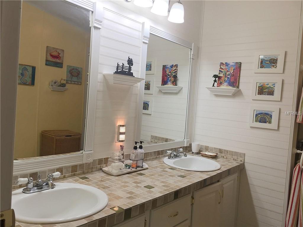 MASTER BATH WITH DOUBLE SINKS AND TILED COUNTERTOP