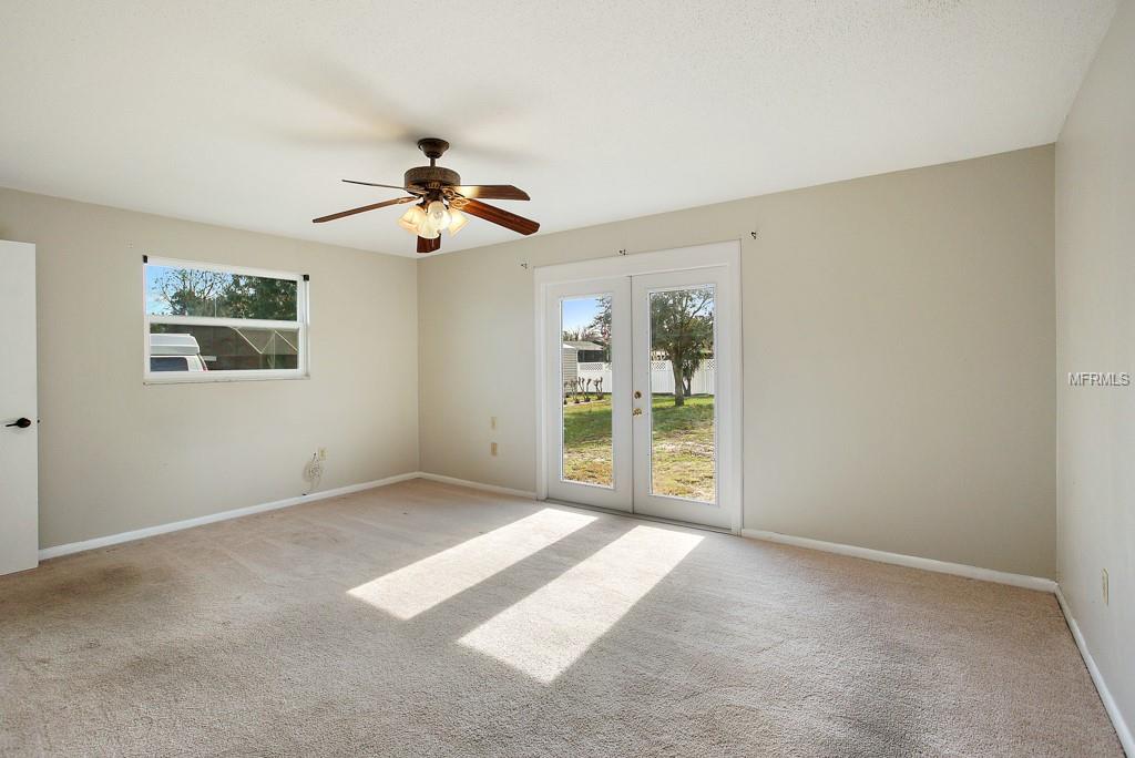 Master bedroom with French doors to back yard