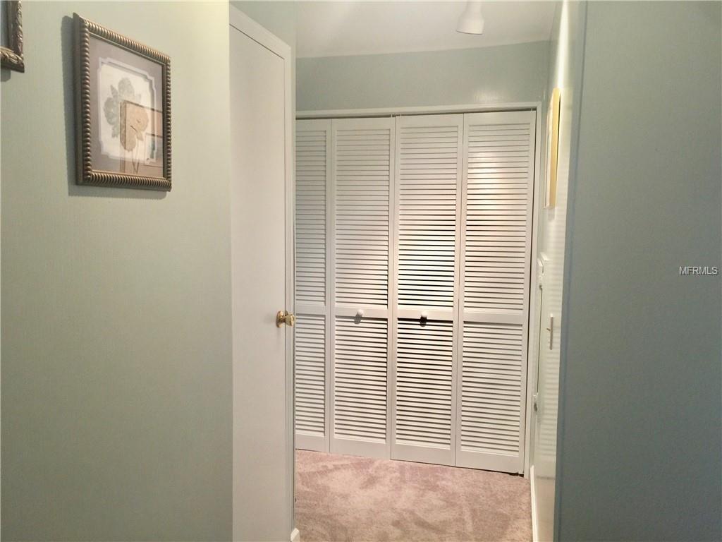 INSIDE LAUNDRY TUCKED BEHIND FOLDING DOORS