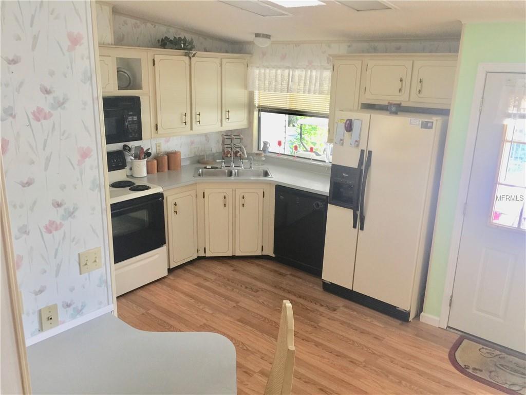 CHECK OUT THE LAMINATE FLOORING IN THE KITCHEN