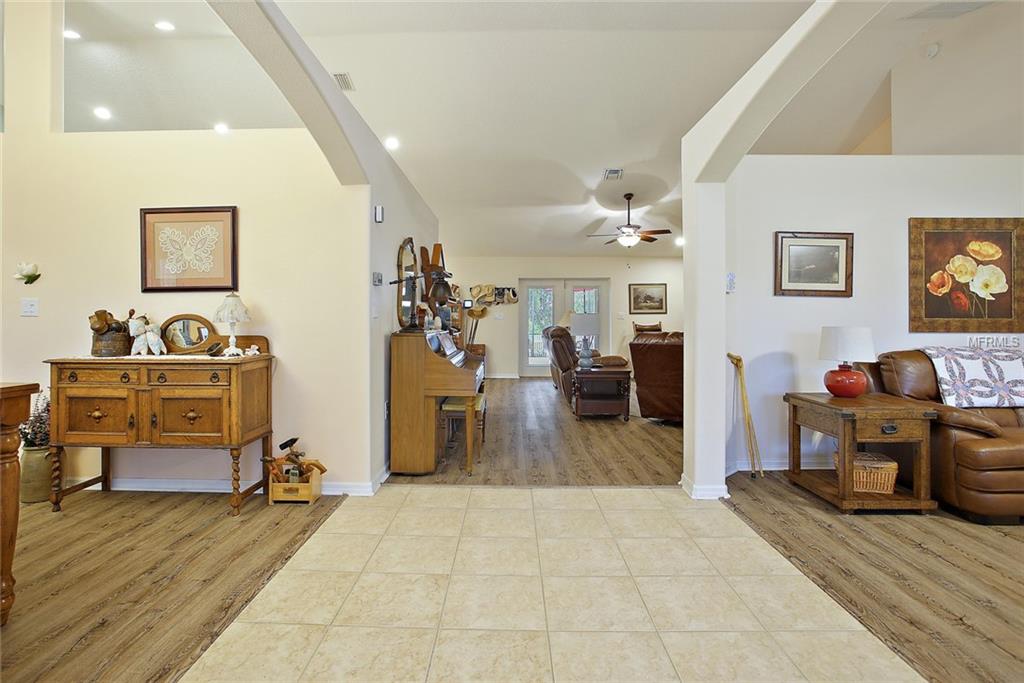VIEW FROM THE FOYER LOOKING INTO FORMAL LIVING ROOM, FORMAL DINING ROOM, AND FAMILY ROOM