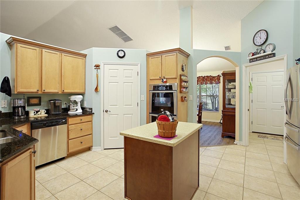 LOTS MORE CABINETS AND STORAGE IN THE KITCHEN INCLUDING AN ISLAND