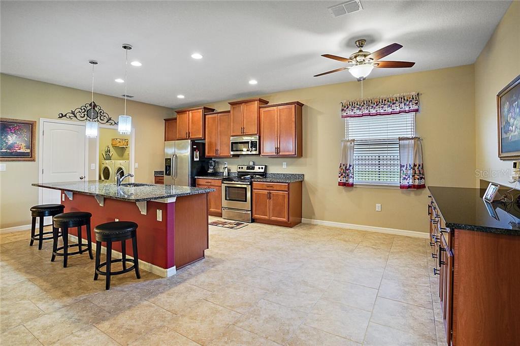 As if there werent enough storage, the current owners added additional cabinets with granite counter tops to the separate Breakfast Nook which may double as a coffee bar, liquor bar, or whatever you choose to make it!