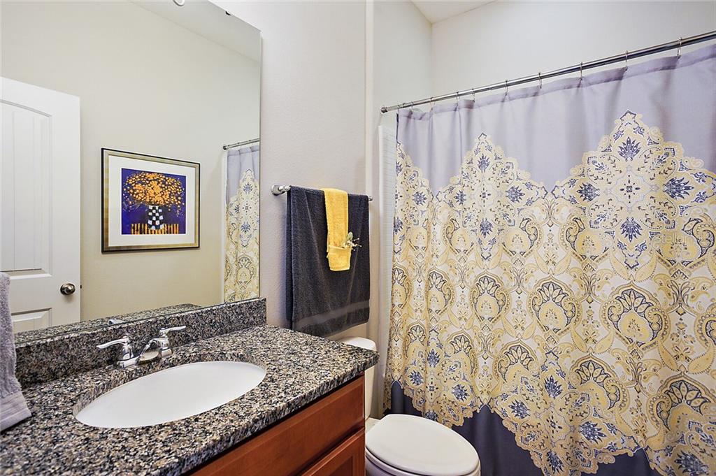 Really pretty Guest Bath #2 with granite counter tops and tub with shower.