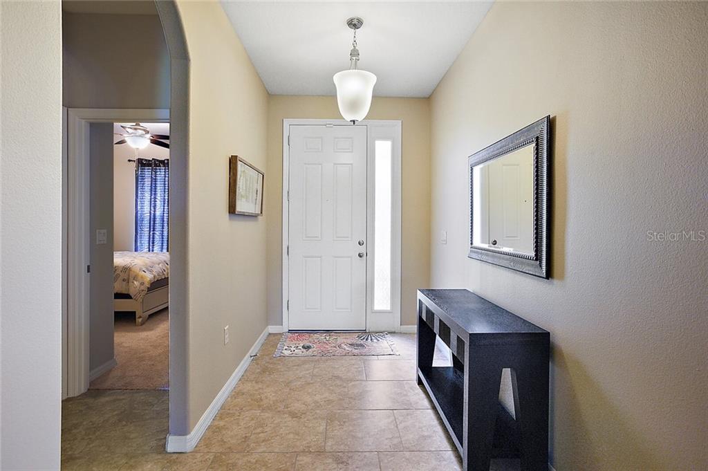 Come on in! Enter through your ample foyer, nicely lit and inviting.