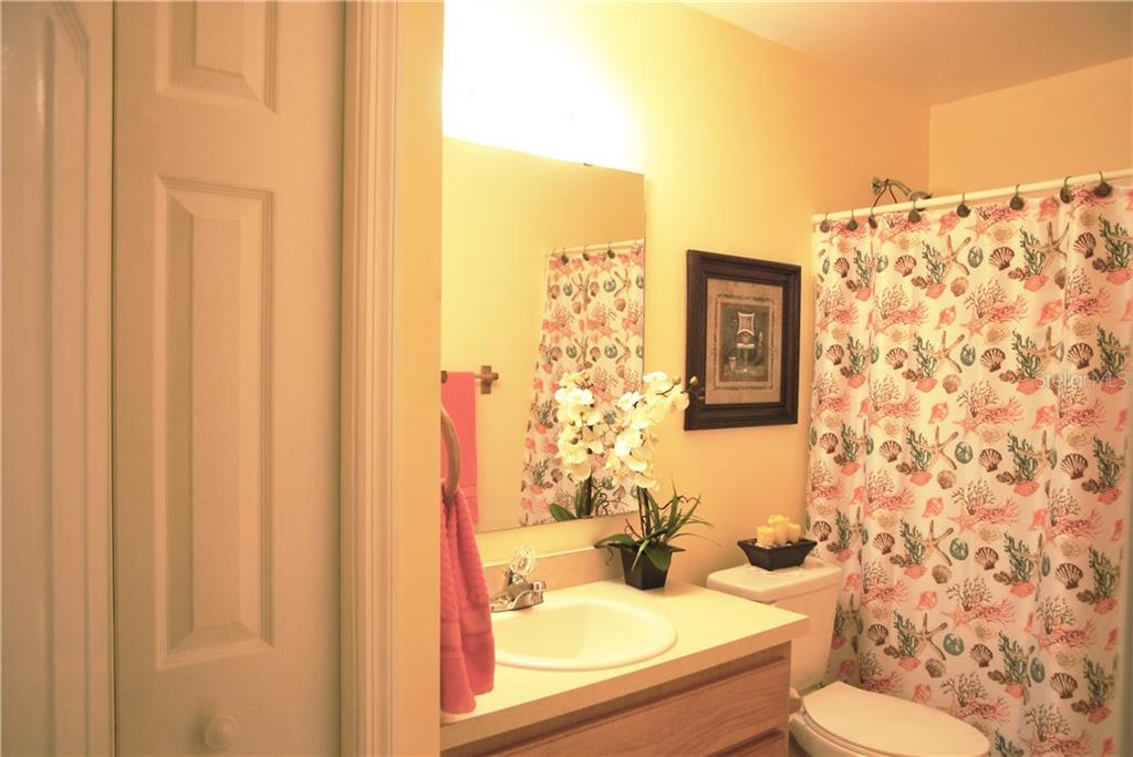 Beautiful Guest Bathroom with linen closet.