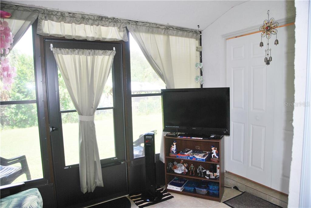 Lanai enclosed so you can have an extra room with a TV to watch sports or just hang out!