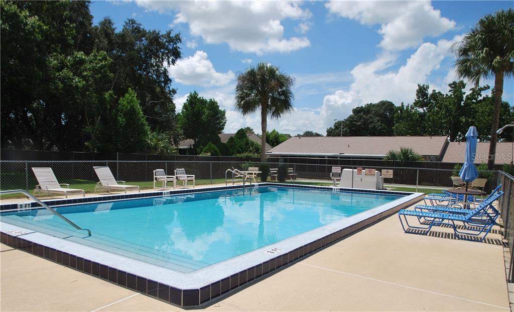 Plenty of lounging places around the pool right next to the Shuffleboard court.