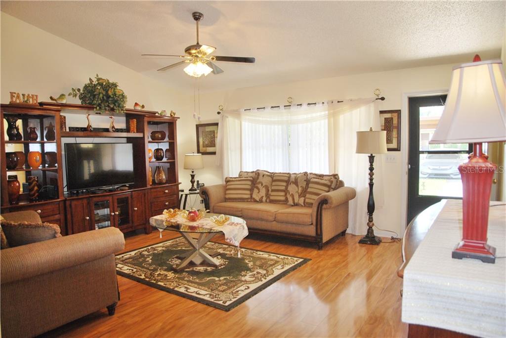 Spacious and bright living room with double windows letting in plenty of Florida sunshine!