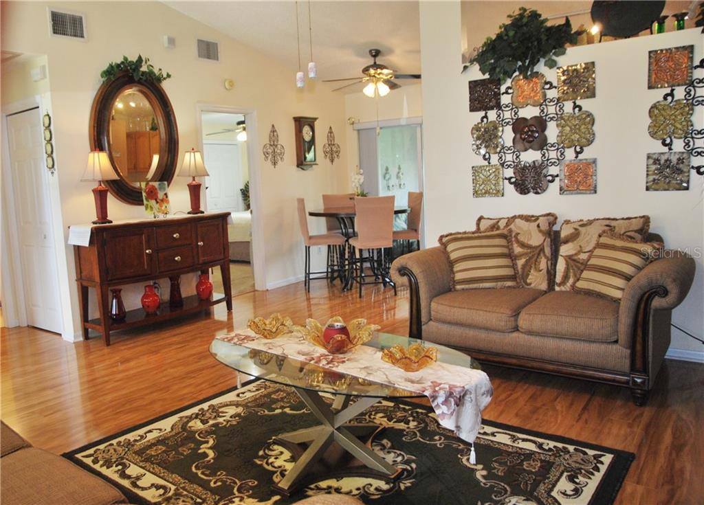 Living Room L-Concept Open to Dining Room.