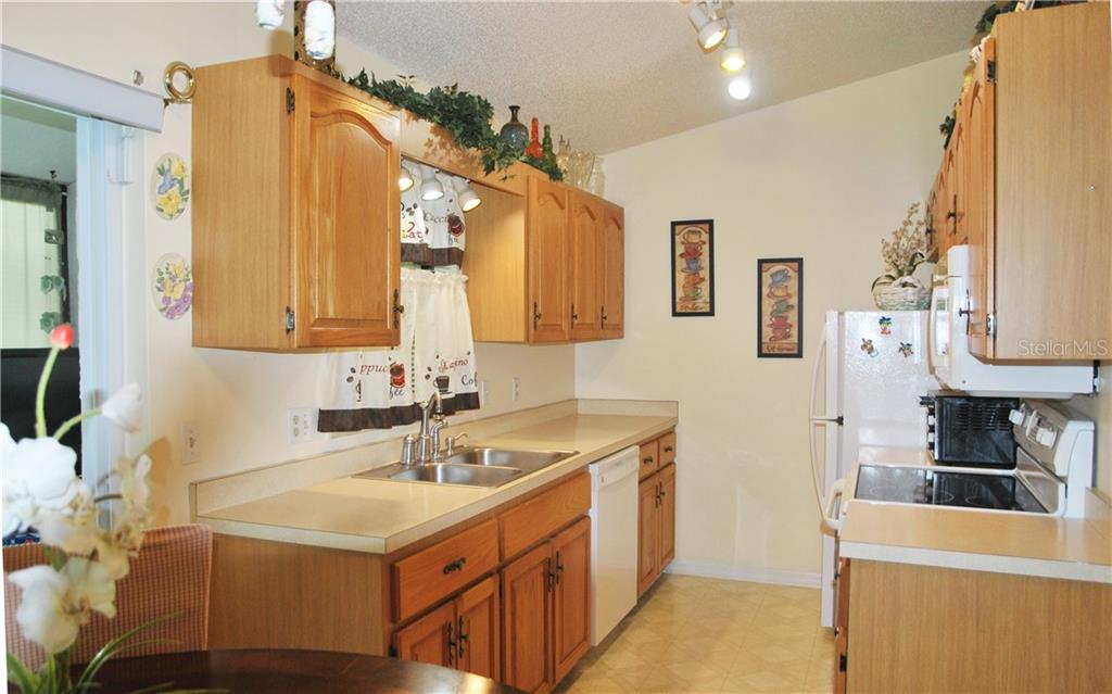 Galley kitchen with plenty of counter-space and storage.