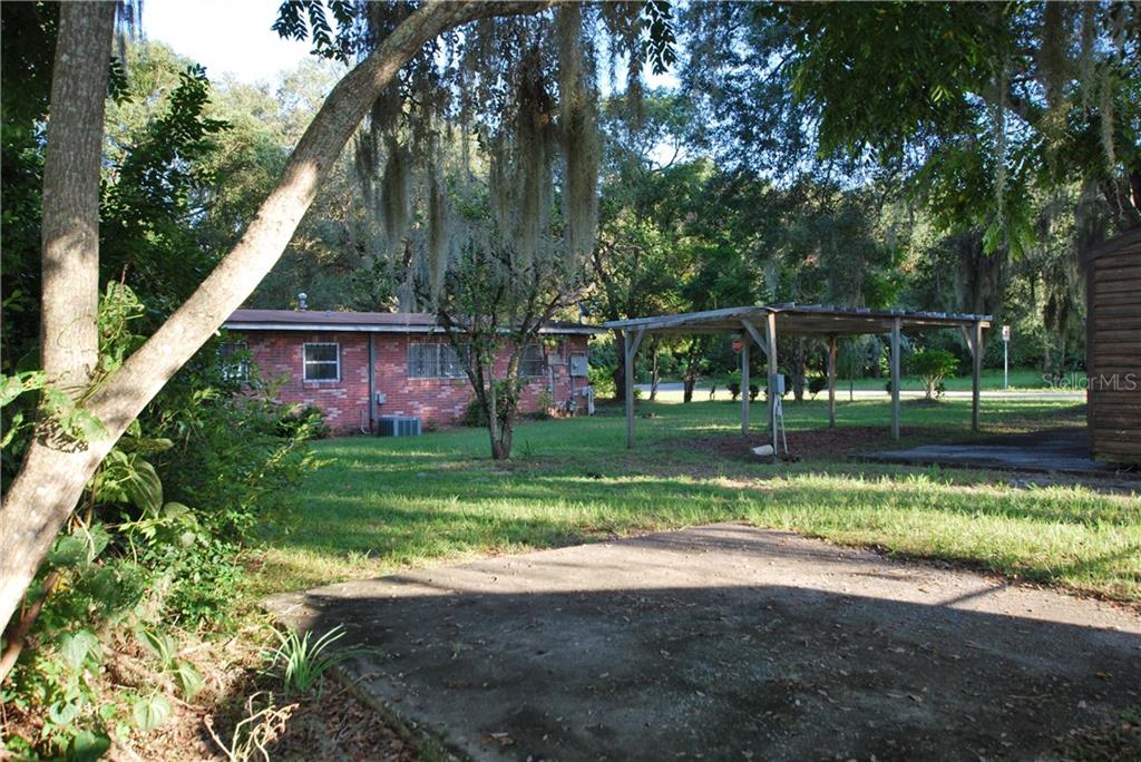 Back yard with concrete slab.