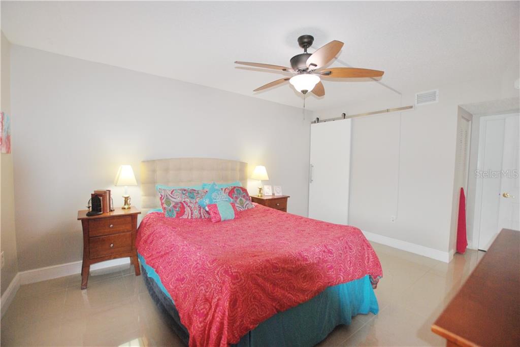 Expansive and extra bright Master Bedroom. Notice the barn doors leading to the en-suite Master Bath.