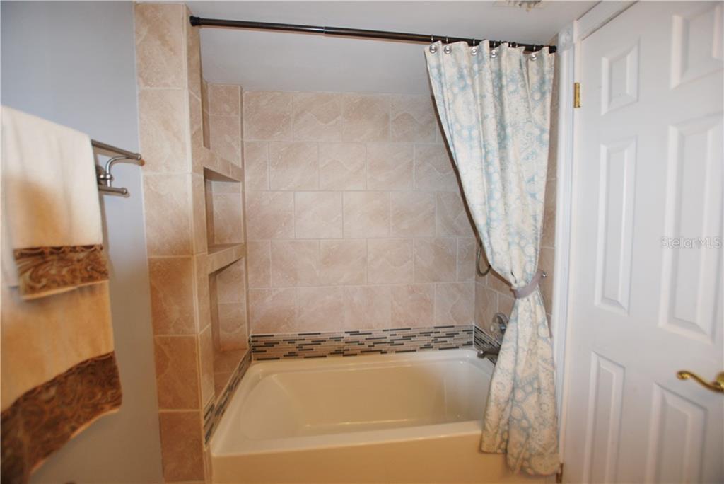 Fully remodeled with new tub and wall tiles.
