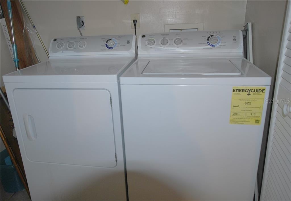 Washer and Dryer Closet in hall.