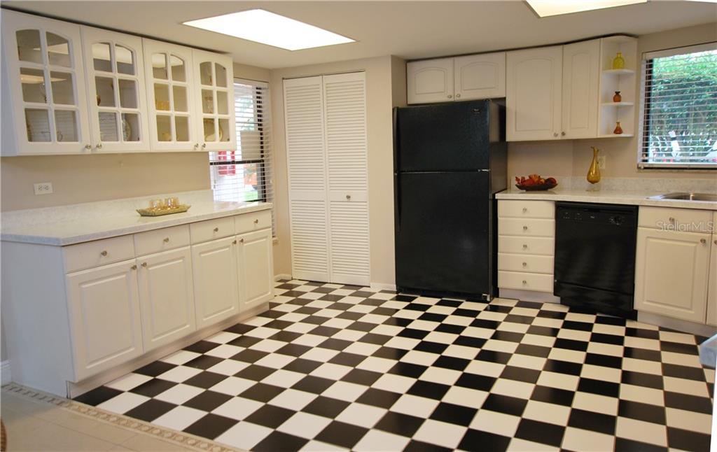 A pantry in addition to the many cabinets.