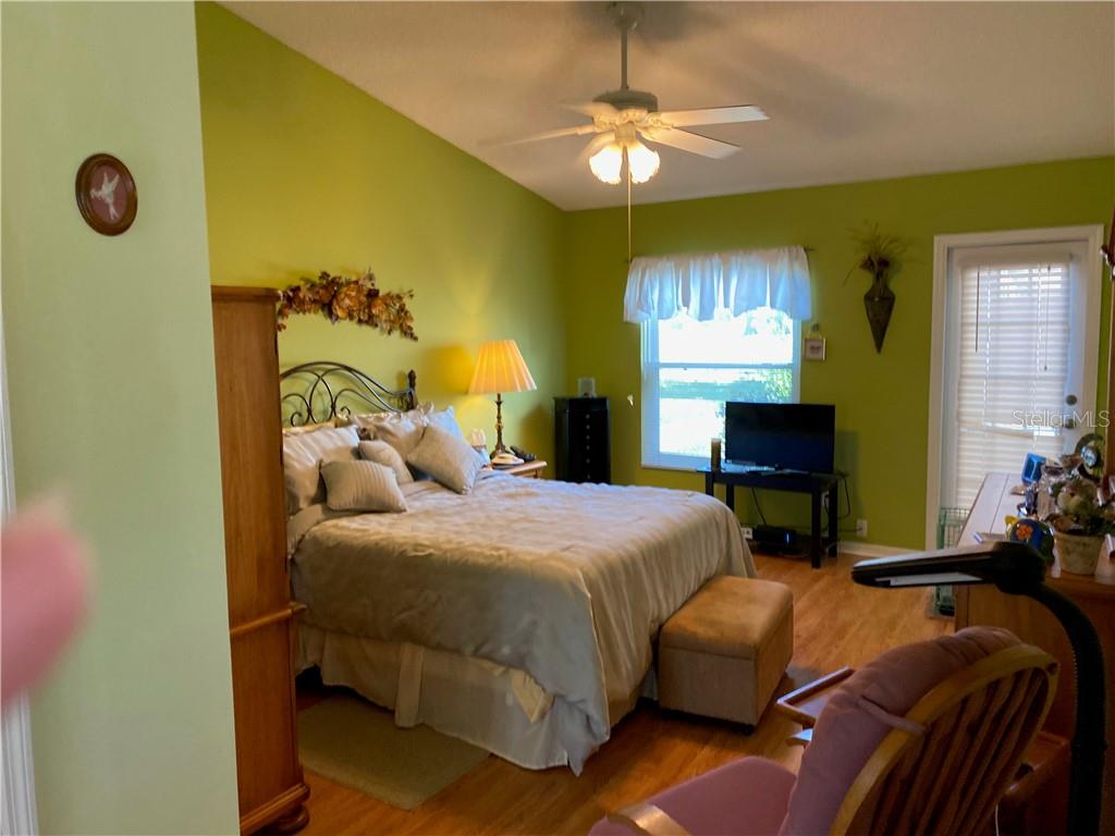 MASTER BEDROOM WITH DOOR LEADING TO THE LANAI