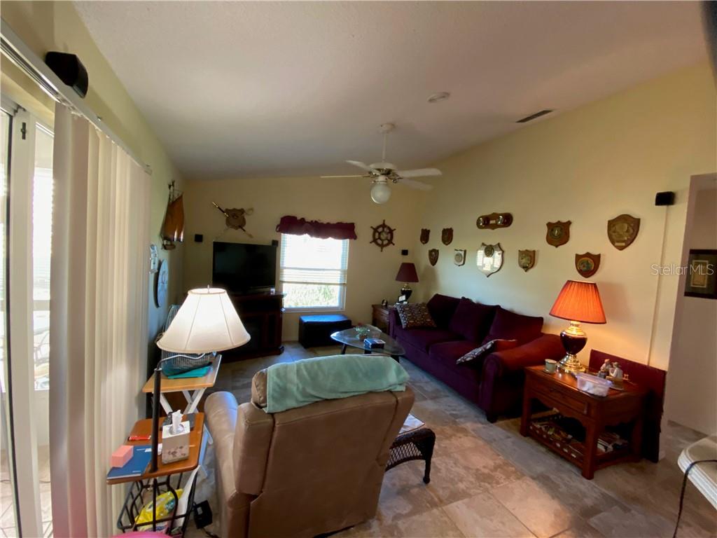 COMFORTABLE FAMILY ROOM WITH BEAUTIFUL TILE FLOORS