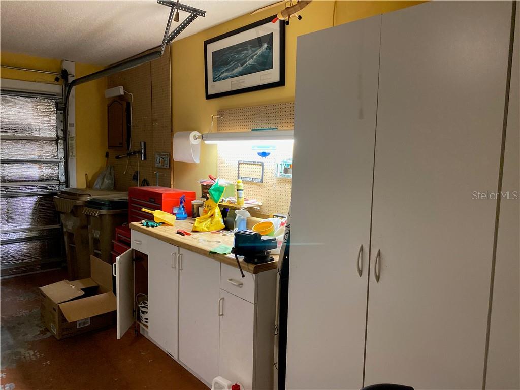 WORKBENCH AND CABINETRY IN GARAGE