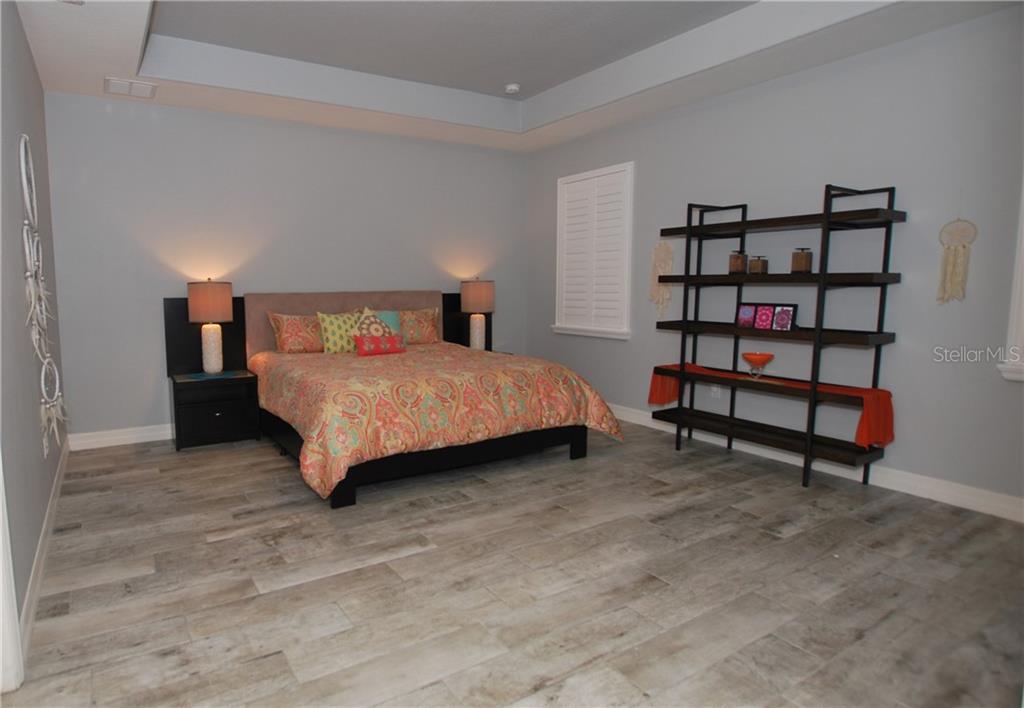 What a dreamy Master Bedroom. Can't get any bigger than this. Notice the beautiful coffered ceiling.