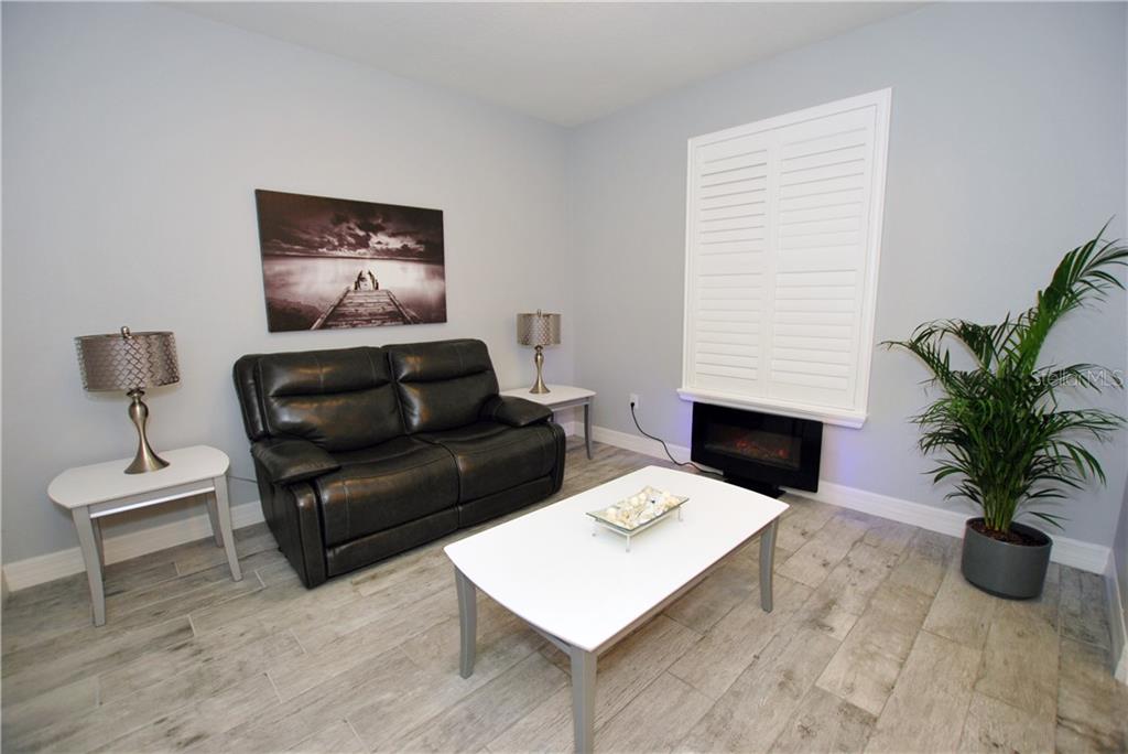 Plantation shutters on every window of the house, providing privacy and beauty.