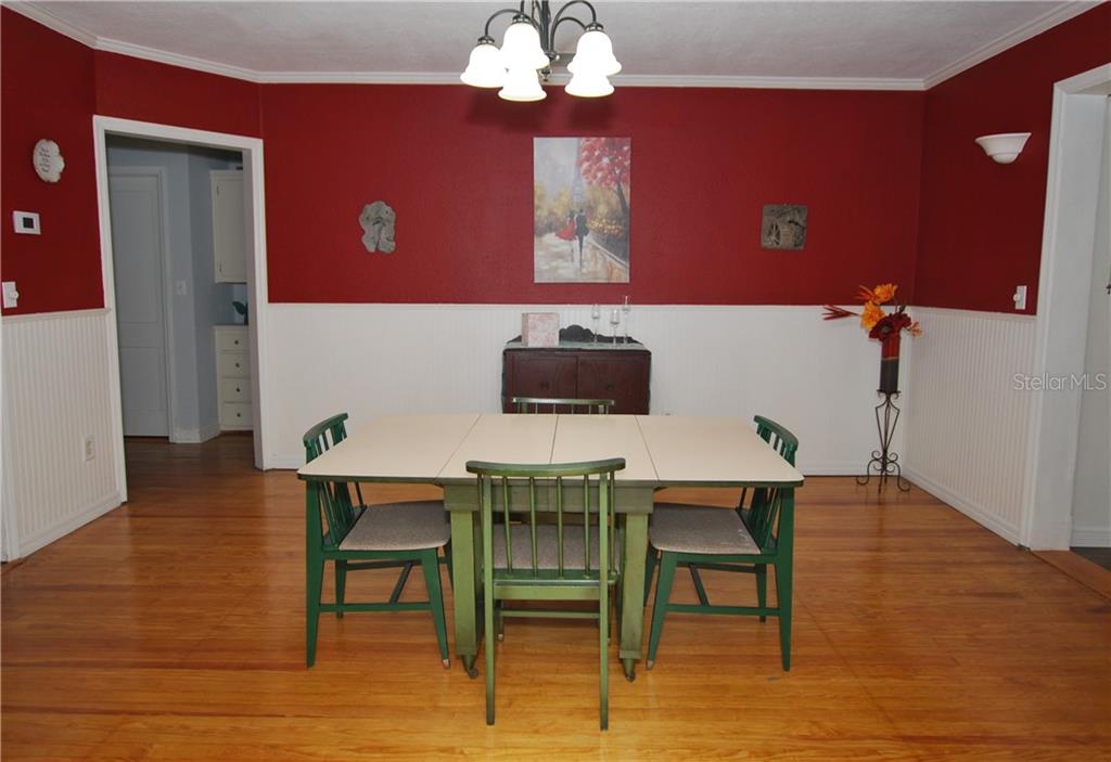 Large Dining Room with an Open Concept, access to the Kitchen on your left and the Living Room on your right.