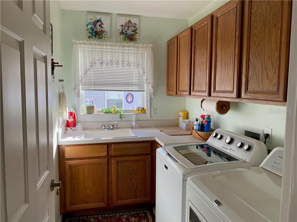 BEAUTIFUL LAUNDRY ROOM WITH SINK AND COUNTER SPACE