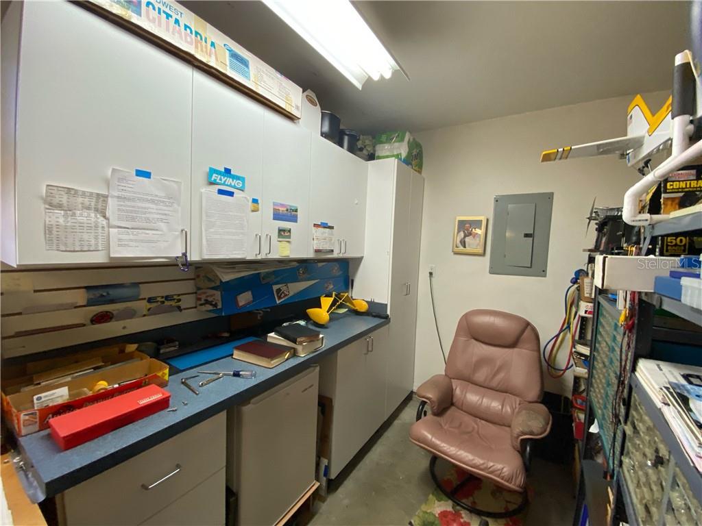 BUILT IN WORKBENCH AND CABINETS FOR THOSE DO IT YOURSELF JOBS AND HOBBIES