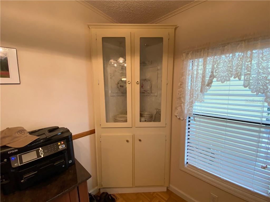 BUILT IN CORNER CABINET IN DINING ROOM