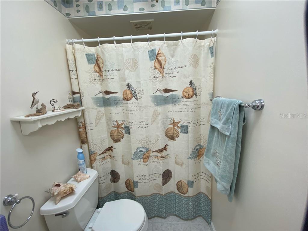 EVEN A KNICK KNACK SHELF OVER THE TOILET