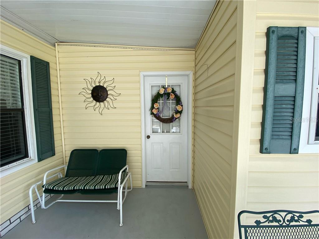 COVERED LOUNGING AREA IN CARPORT EXTENSION