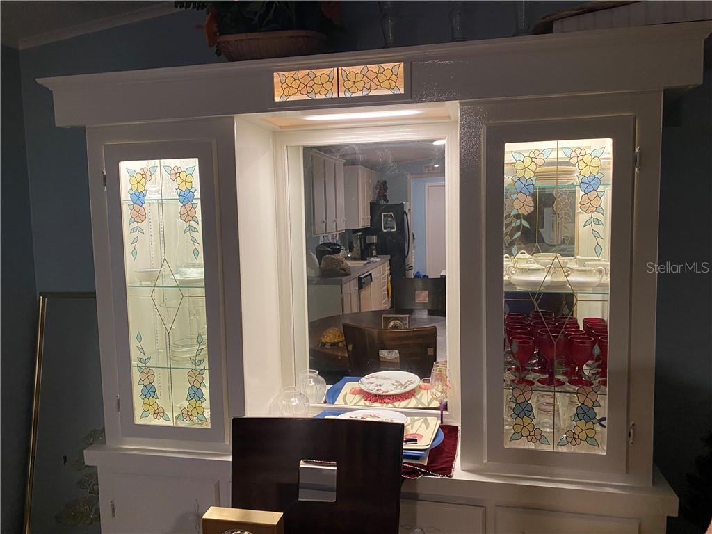 FRESHLY PAINTED CHINA CABINET IN DINING ROOM