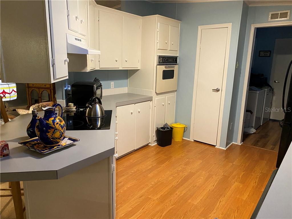 FRESHLY PAINTED KITCHEN CABINETS WITH NEW COOKTOP