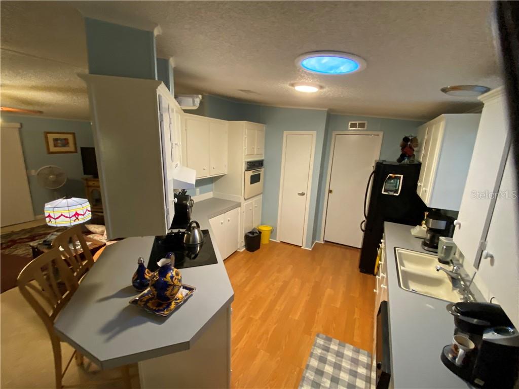 OPEN KITCHEN AREA TO DINING ROOM AND LIVING ROOM