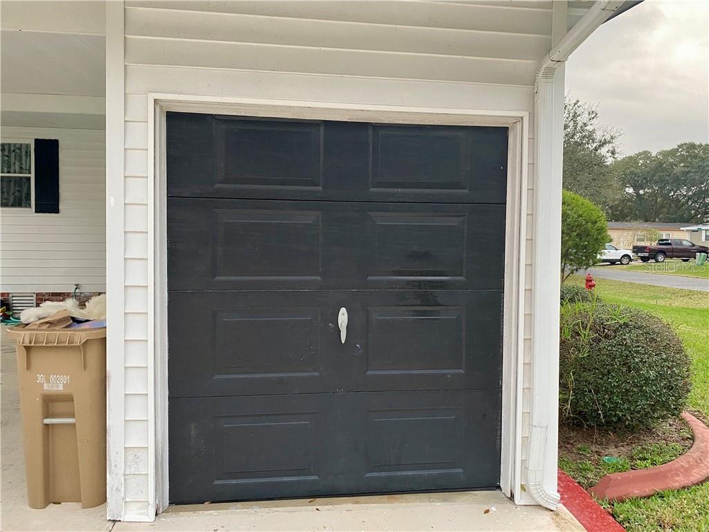 NICE SIZED GOLF CART GARAGE WITH ADDED STORAGE